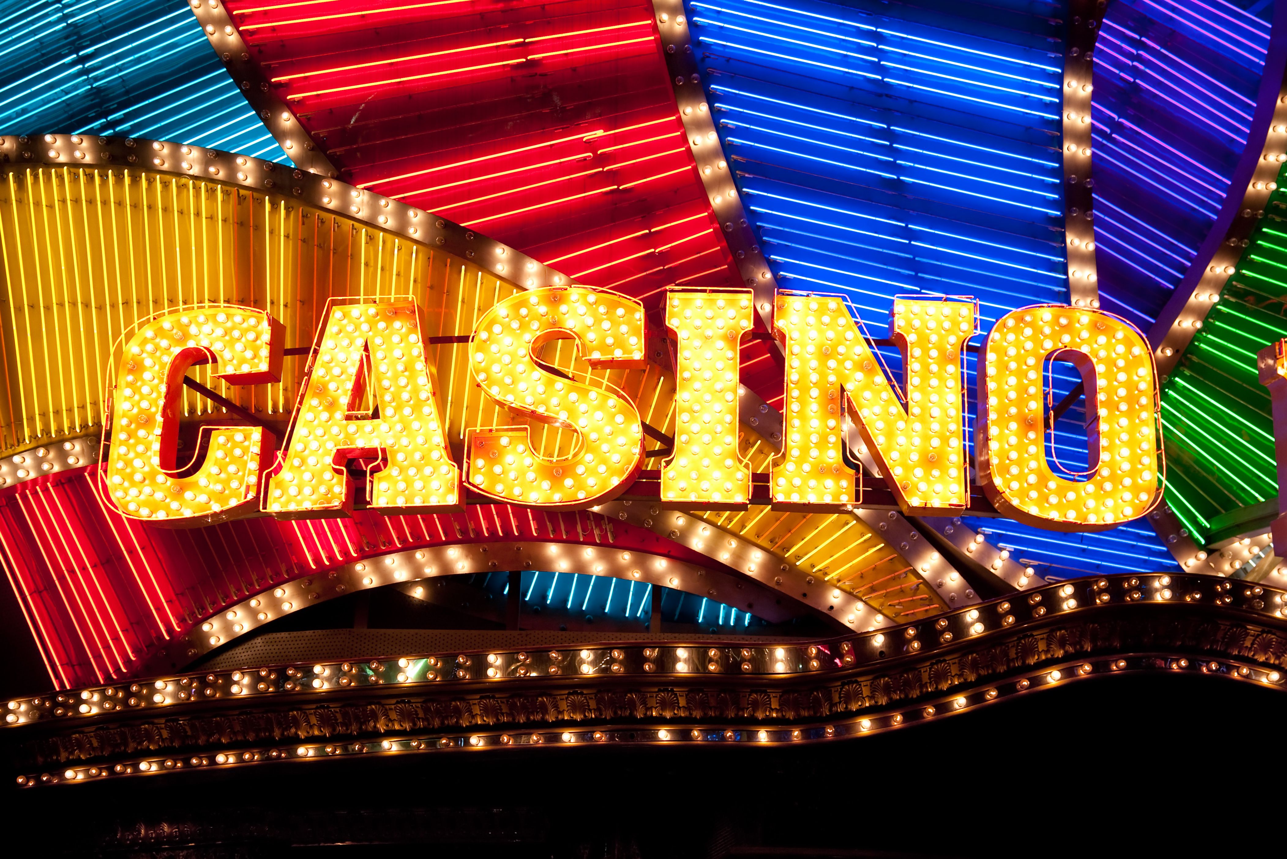 A graphic showing the Tropicana Casino logo transitioning into the Caesars Palace Online Casino logo.